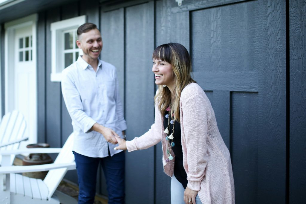 Real estate agent talking with a client, representing bilingual REALTOR® services in Maryland
